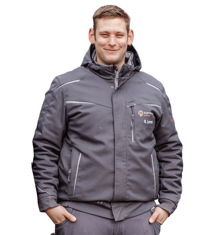 Elektromeister Nils Lorenz – Geschäftsführer Elektrotechnik Lorenz Coesfeld Porträtfoto von Elektromeister Nils Lorenz, Geschäftsführer von Elektrotechnik Lorenz in Coesfeld, in grauer Arbeitsjacke